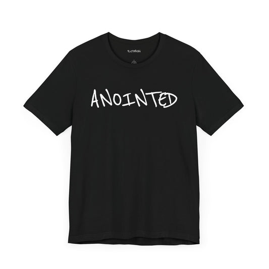 Black t-shirt with handwritten white “ANOINTED” text across the chest
