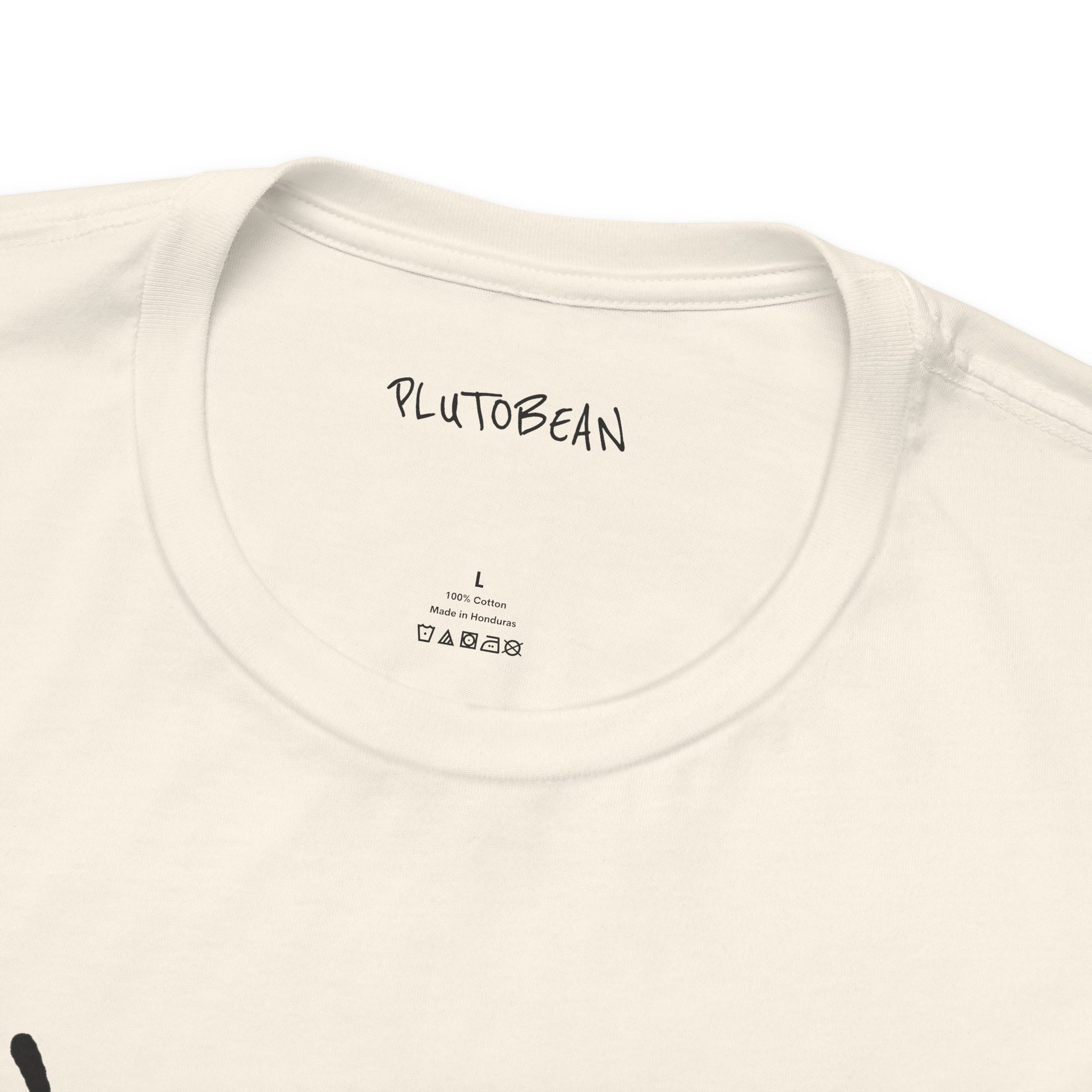 Close-up of neckline and tag on ANOINTED tee in natural with black lettering