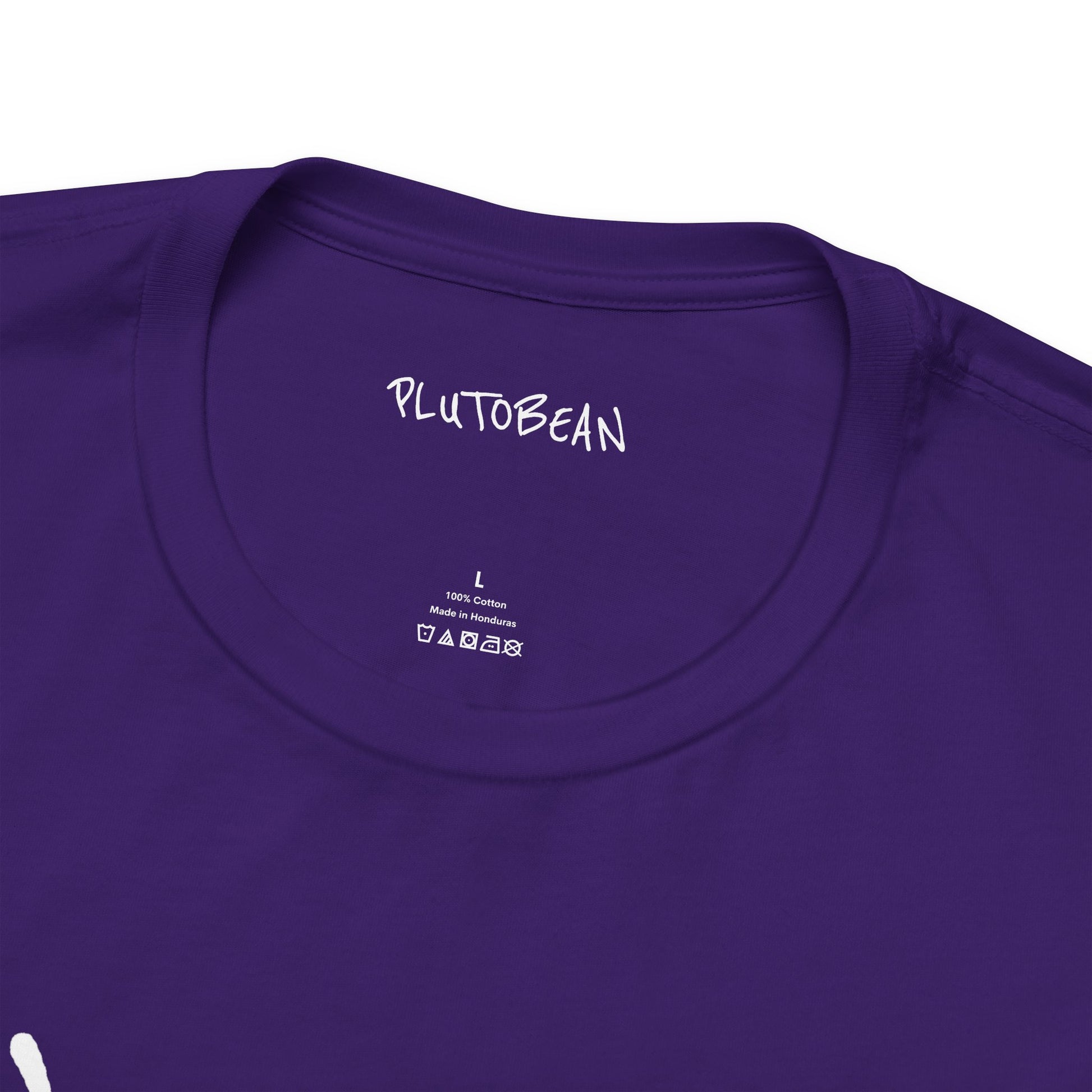 Close-up of collar and tag on ANOINTED purple tee with white text