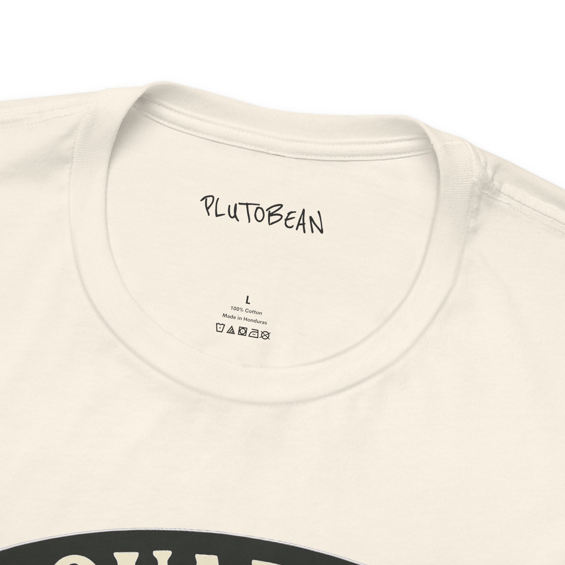 Close-up of a beige t-shirt with 'PLUTOBEAN' branding on the collar.