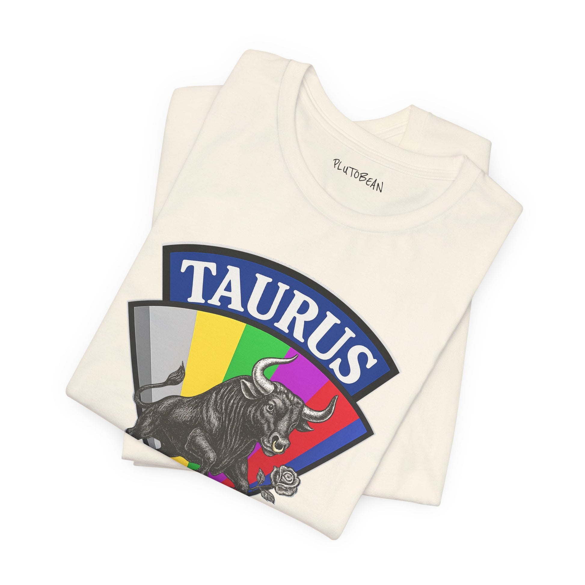Folded t-shirt with Taurus zodiac design on a white background