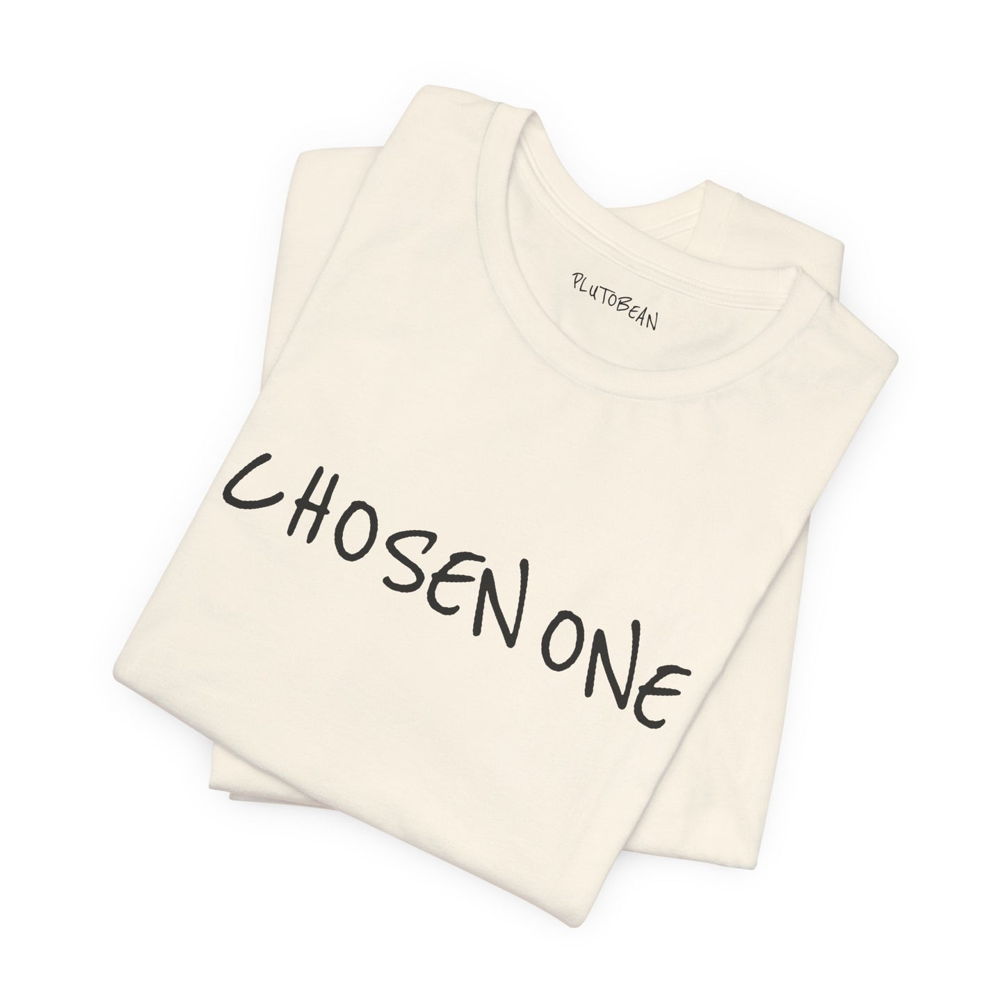Folded natural tee featuring bold black “CHOSEN ONE” graphic