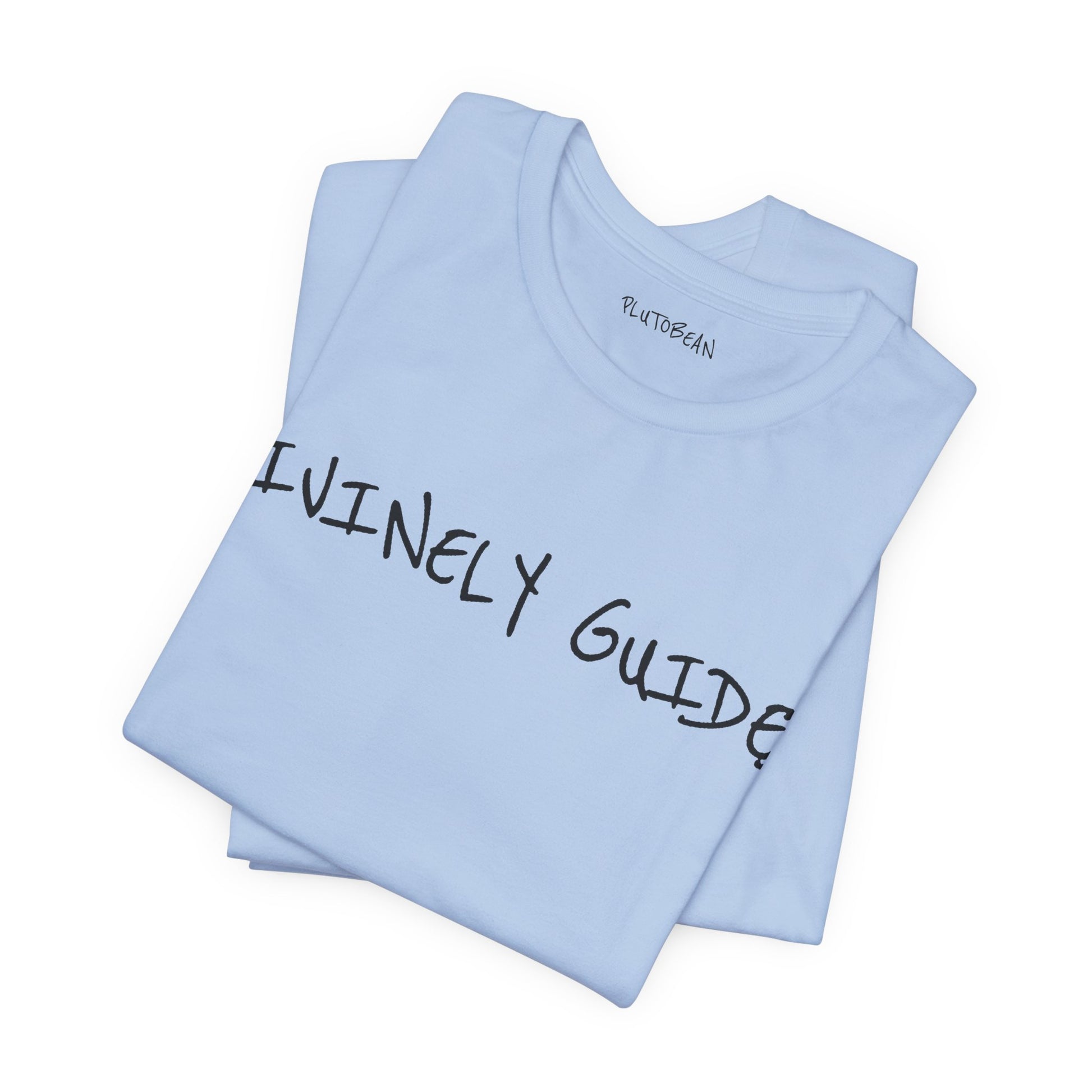 Folded baby blue tee featuring bold handwritten “DIVINELY GUIDED” design