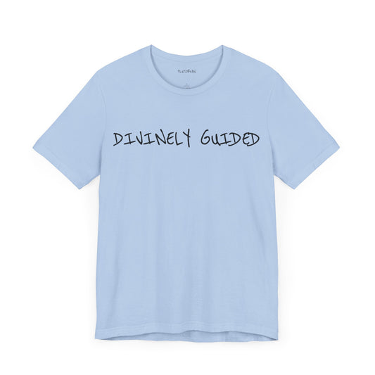 Baby blue t-shirt with handwritten black “DIVINELY GUIDED” text across the chest