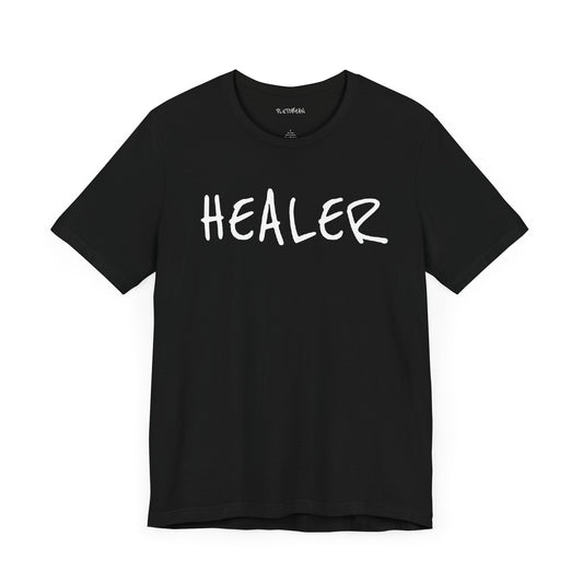 Black t-shirt with handwritten white “HEALER” text across the chest