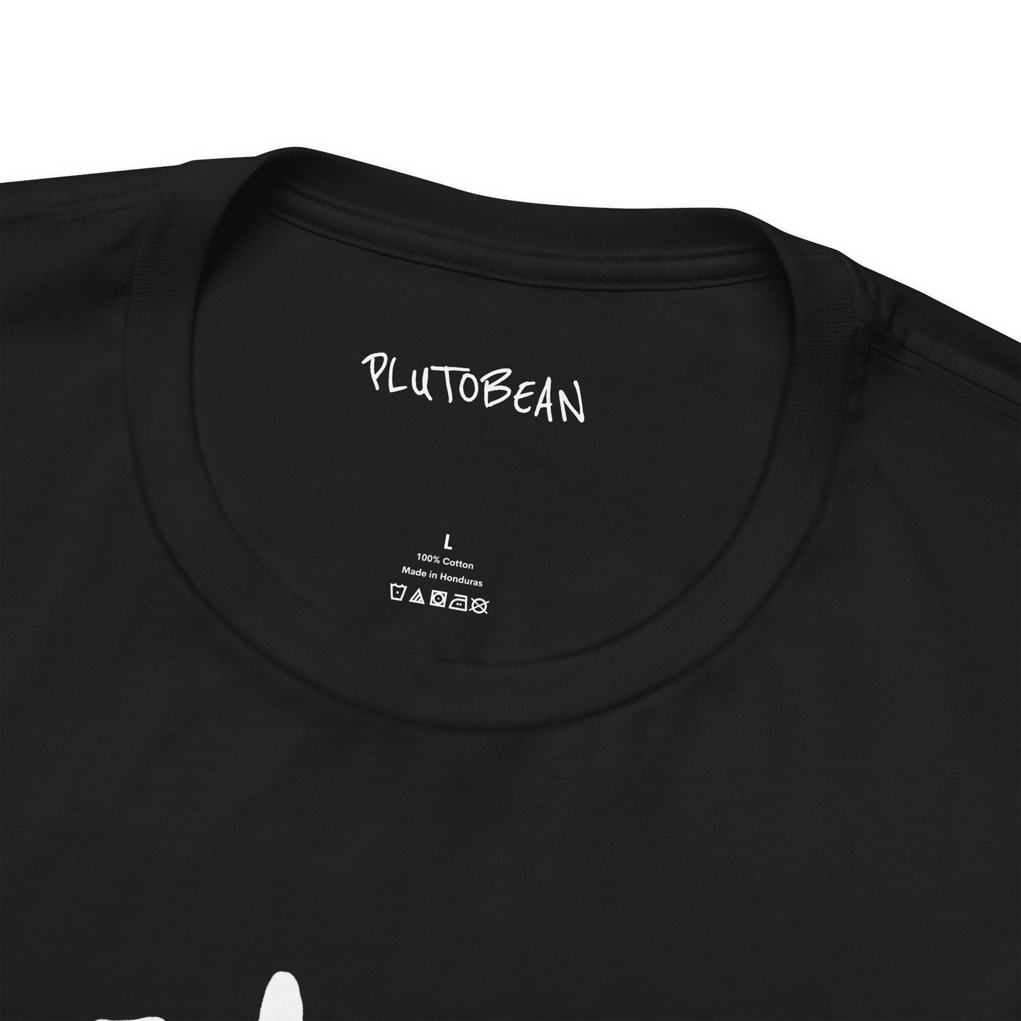 Close-up of neckline and inner label on HEALER tee in black with white lettering