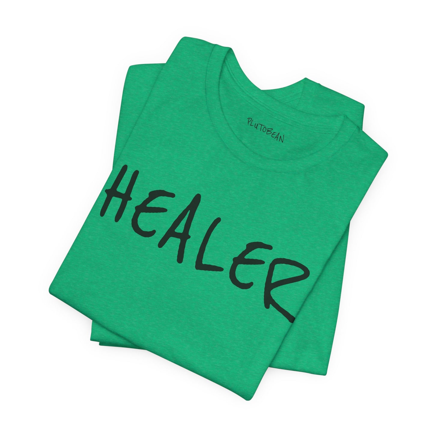 Folded Heather Kelly green tee with bold handwritten “HEALER” text