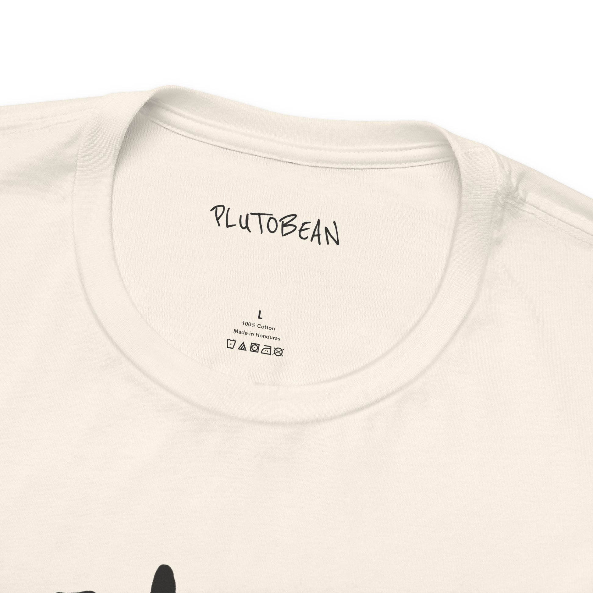 Close-up of neckline and inner tag on natural HEALER tee with black lettering