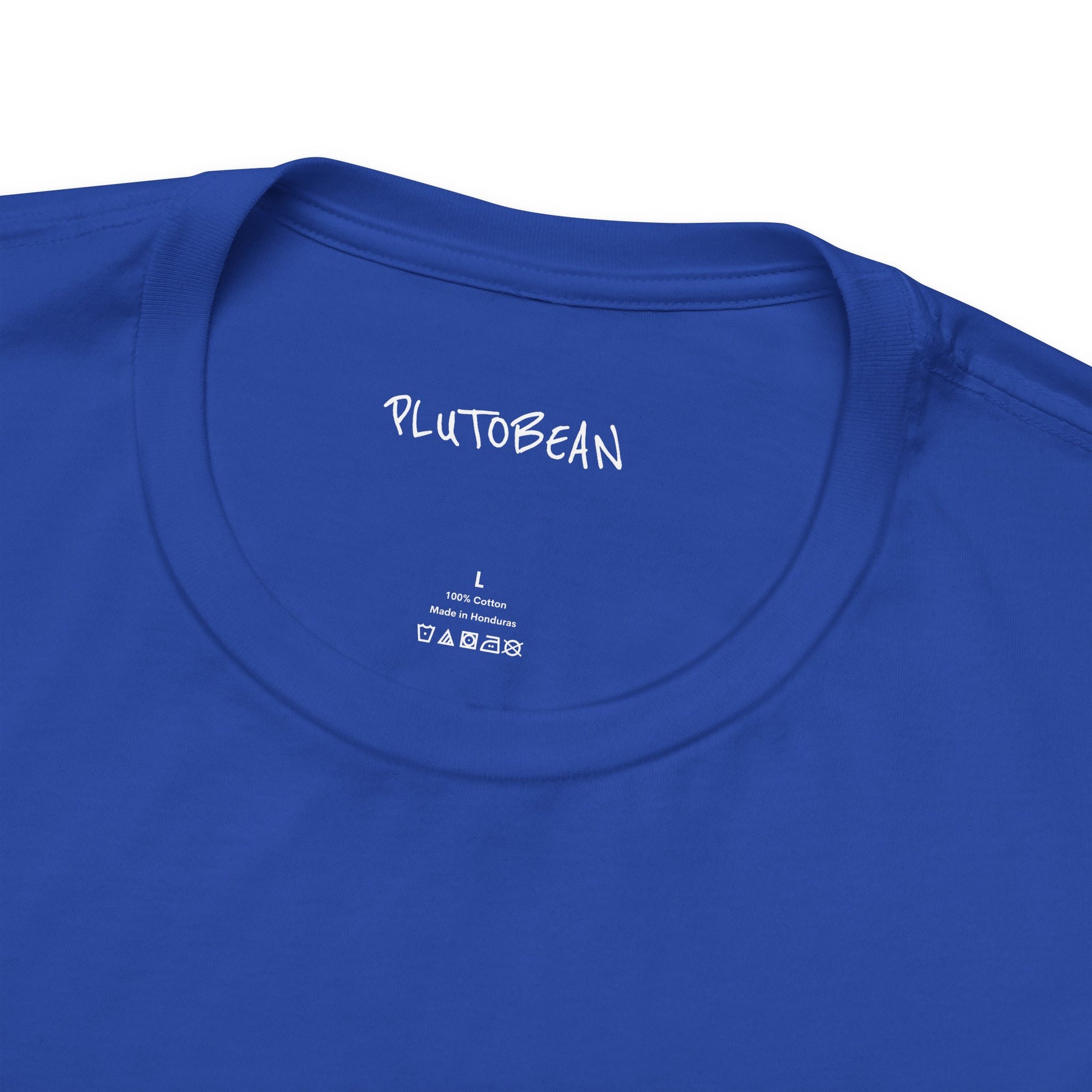 Close-up of neckline and tag on STARCHILD blue tee with white lettering