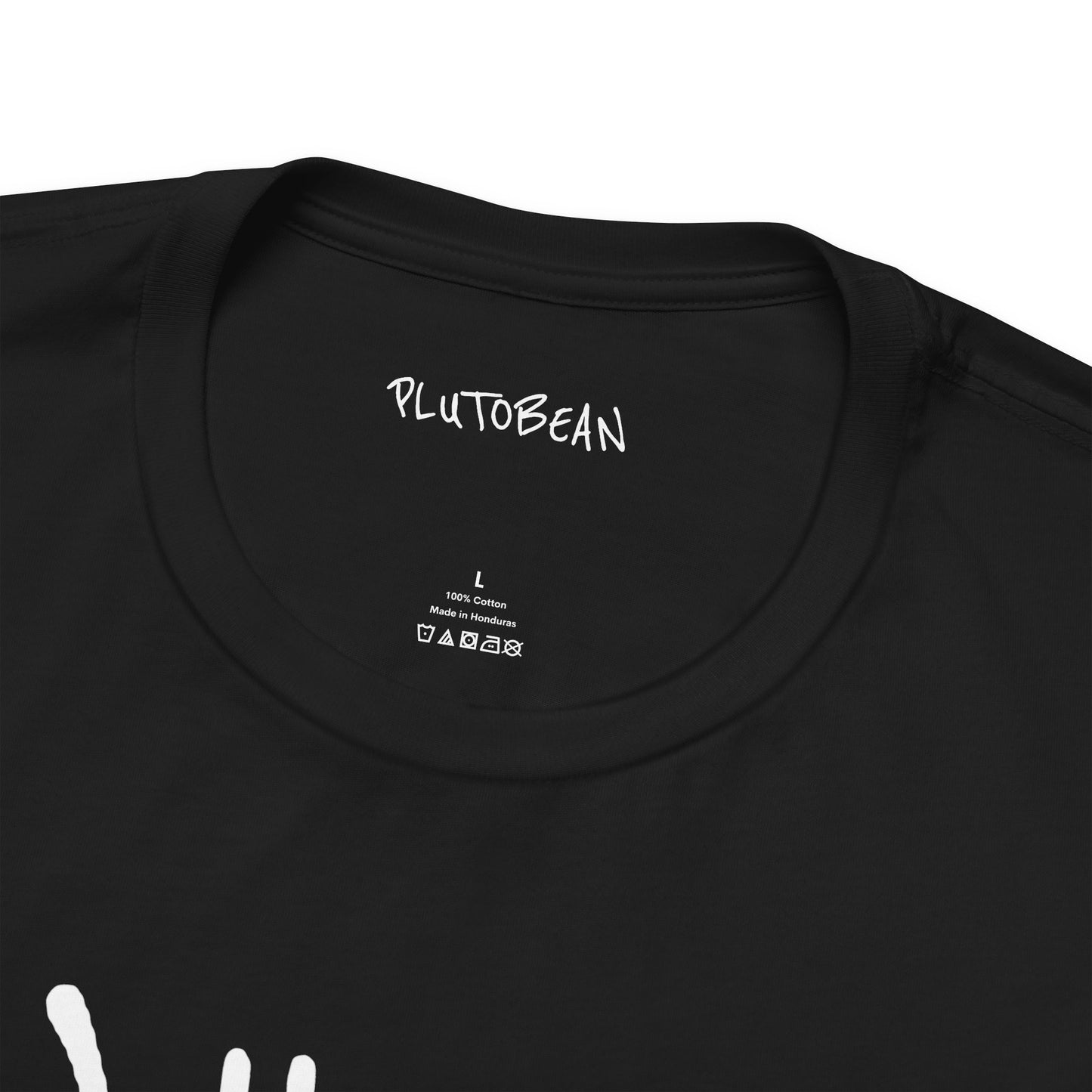 Close-up of black t-shirt collar showing PLUTOBEAN tag on “Where Is My Soul Tribe?” tee